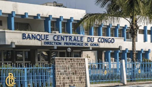 Exterior of Banque Centrale du Congo, Goma branch, with blue accents and a palm tree.