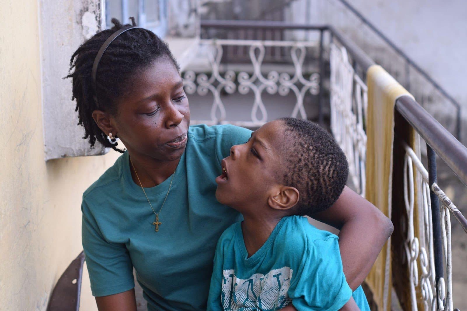 Modupe Famodun, 40, and her eight-year-old son, Tiolu, who lives with cerebral palsy. Photo Credit: Samuel Okoro.