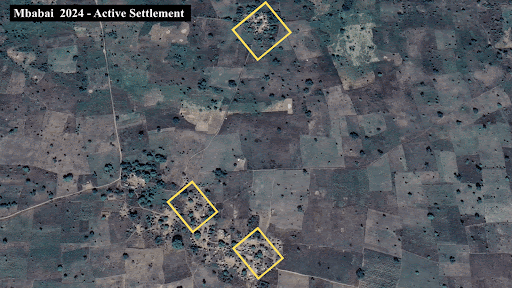 Aerial view of Mbadabi 2024, showing active settlements outlined with yellow squares amidst a patchwork landscape.