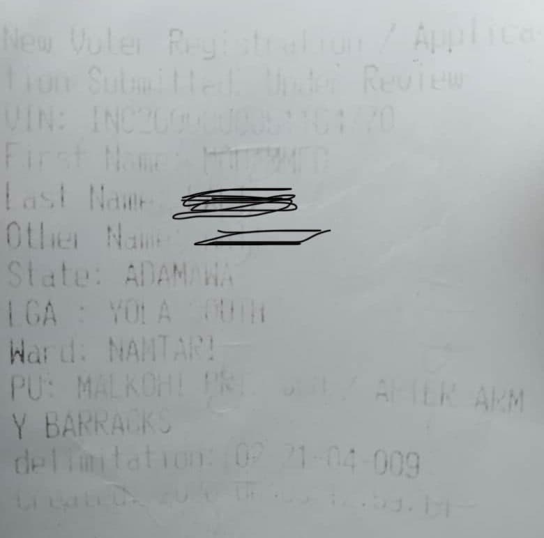 Blurred voter registration receipt with details including state (Adamawa), LGA (Yola South), and ward (Namtari).