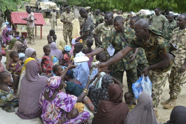 Military giving water to civilians in Borno State