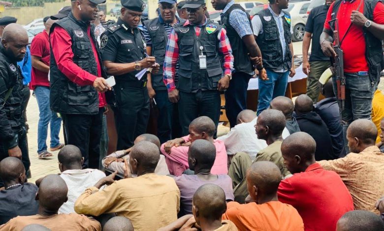 Security forces parading armed criminals operating across Nigeria.