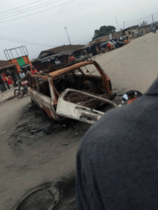 Photo: Ambulance with dead bodies inside burnt by Nigerian forces in Oyigbo. Photo with the bike our motorcyclist source in motion. (Credit: Taiwo-Hassan Adebayo/PREMIUM TIMES)