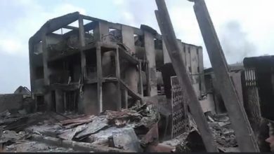 Photo: A screenshot from live video of the razed buildings. Credit: BBC Pidgin.