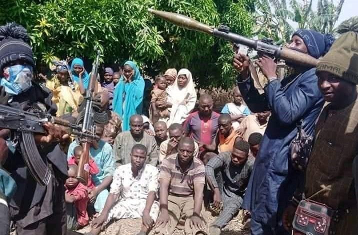 File photo: Terrorists in Niger State brandish heavy arms in front of recent victims of abduction