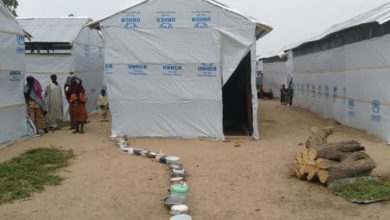 Queue of pots awaiting the distribution of cooked food at an IDP camp in Dikwa, Borno state. Photo: UNHCR