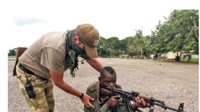 A Russian Military Working With A Member Of The Central African Armed Forces