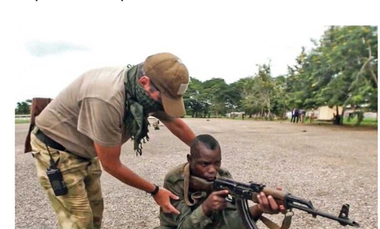 A Russian Military Working With A Member Of The Central African Armed Forces