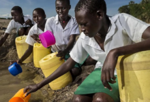 School girls fetch water from a dry riverbed in Lake Turkana is too saline for human consumption.