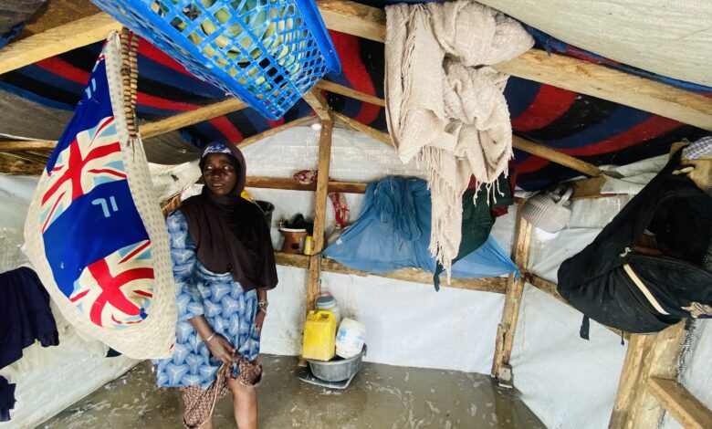 Hadiza Umar Ali stands in her flooded tent in a camp in Shuwari V camp.