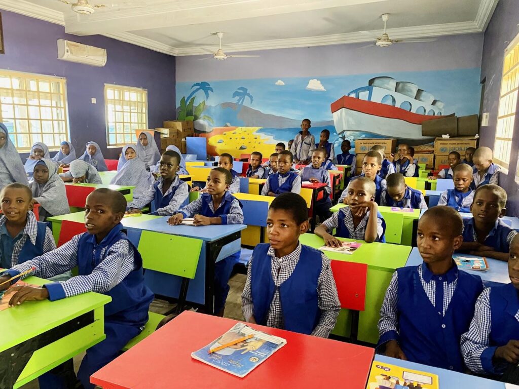 Some of the pupils in their classroom.