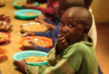 Malnourished children feasting on substandard food offered to them. Picture by the Borgen Project
