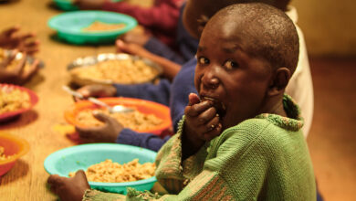 Malnourished children feasting on substandard food offered to them. Picture by the Borgen Project