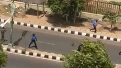 A screenshot from the video shows the police retreating after the clash. 