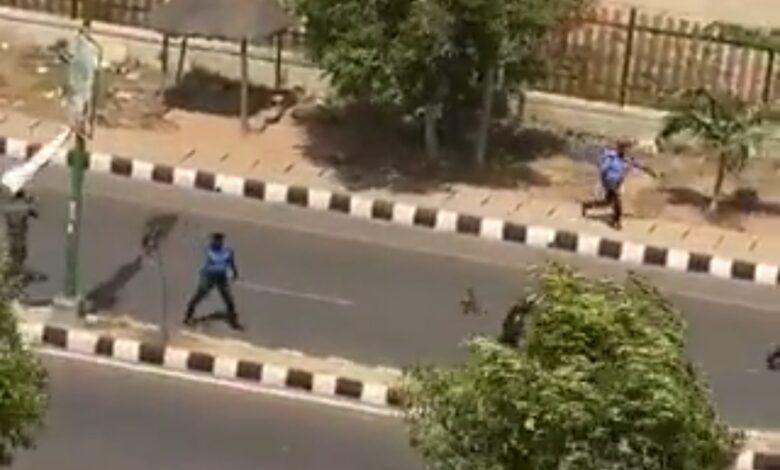 A screenshot from the video shows the police retreating after the clash. 