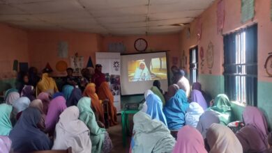 Over 50 women in Malali village gather to watch a six-minute documentary during PAGED Initiative’s advocacy campaign to break down barriers against girls’ education in Kaduna on Dec. 13. Photo: Nathaniel Bivan/HumAngle 