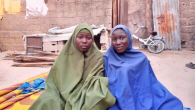 Zarah Adamu (in blue) and her sister in their home in the London Ciki community of Borno State. Photo: Al’amin Umar/HumAngle.