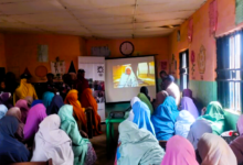 Over 50 women in Malali gathered in a classroom to watch a documentary on women who could not have an education. Photo: Nathaniel Bivan/HumAngle.