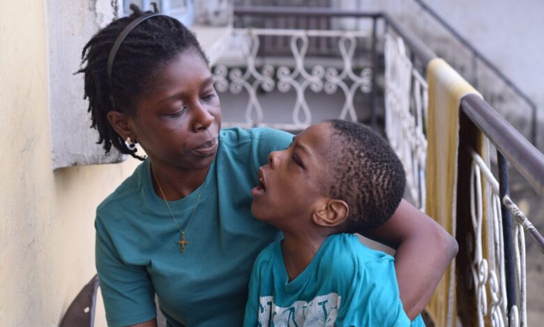 Modupe Famodun, 40, and her eight-year-old son, Tiolu, who lives with cerebral palsy. Photo Credit: Samuel Okoro.