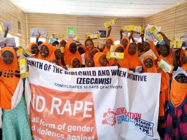 A group of women holding signs that say id rape.