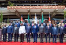 Group of dignitaries posing for a photo at the Kenyatta International Convention Centre.