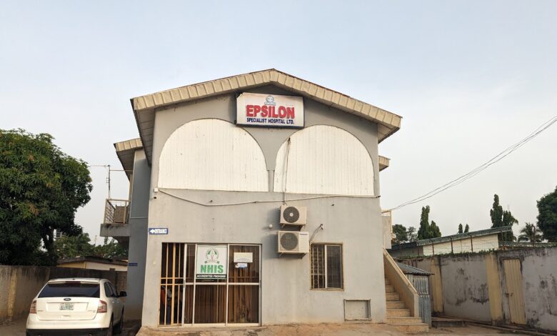 A two-story building with a sign reading "EPSILON SPECIALIST HOSPITAL LTD." and an air conditioning unit outside.
