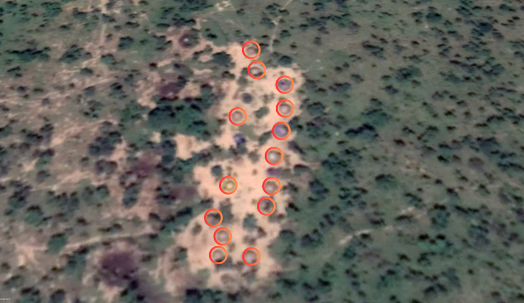 Aerial view of landscape with eleven red circles highlighting specific areas.