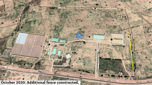 Aerial view of a compound with new fence construction highlighted, dated October 2020.