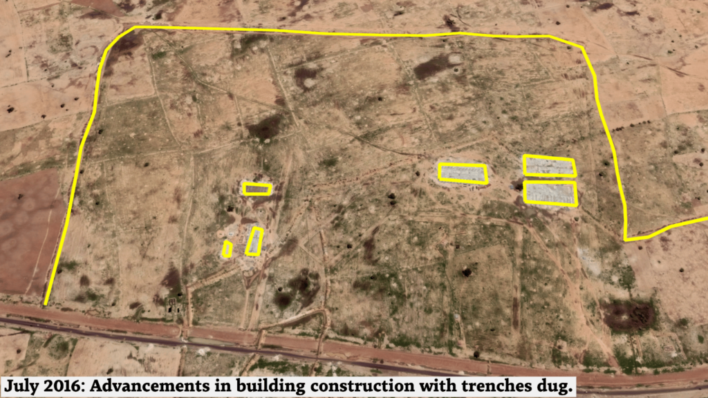 Aerial view of a construction site with trenches outlined, indicating early stage development.