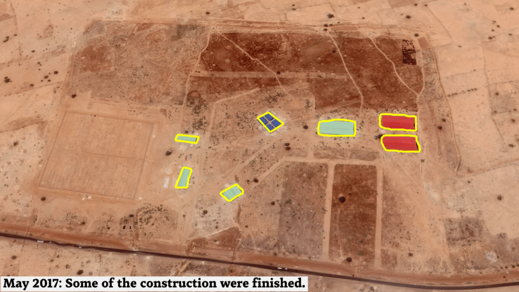 Aerial view of a construction site with completed areas highlighted and a caption about progress from May 2017.