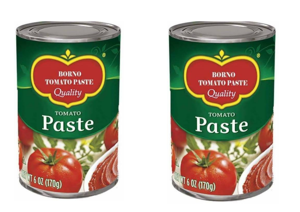 Two cans of Borno Tomato Paste on a white background.