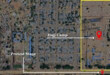 Satellite view of an urban area with labeled locations: Hajj Camp, Protest Stage, and a mosque.