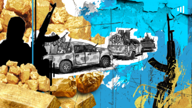 Stylized, collage-like image of silhouetted protesters, vehicles carrying goods, with gold nuggets and splattered ink.