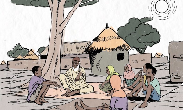 Group of people sitting under a tree in a village setting, with thatched huts in the background.