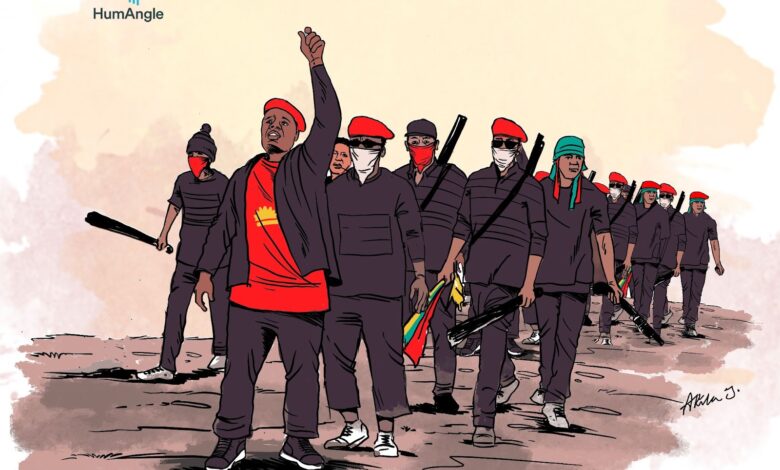 Illustration of a group of people in uniform, some armed with bats, one leading with a raised fist.