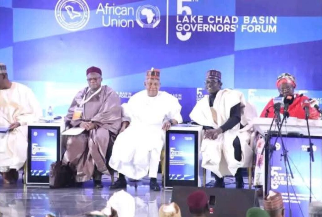 Officials seated at the 5th Lake Chad Basin Governors' Forum, African Union backdrop.