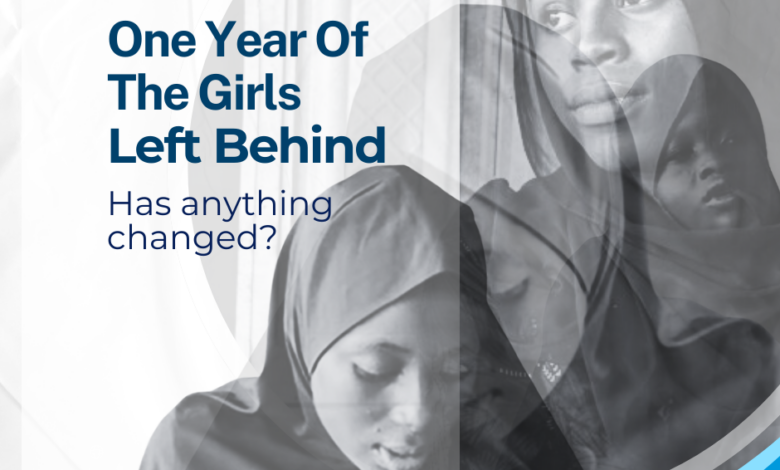 Black and white image of girls in hijabs with text: "One Year Of The Girls Left Behind. Has anything changed?" #BirninYauriGirls