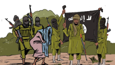 A group of armed figures in green clothing, some masked, with one holding a black flag with white Arabic text.