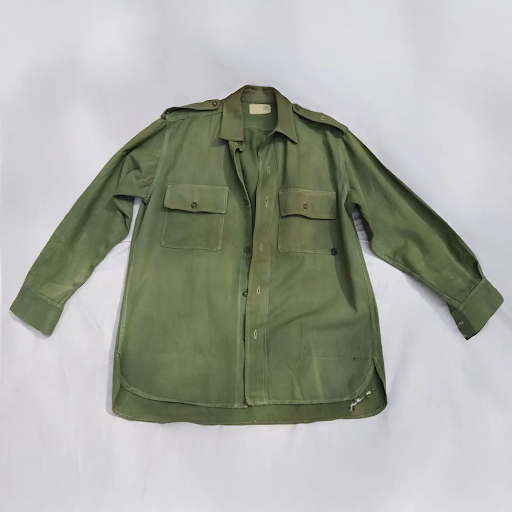 Olive green military-style shirt with buttoned front, epaulettes, and two chest pockets on a white background.
