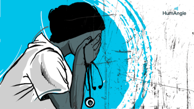 Worried healthcare worker with stethoscope covering face in distress against a blue background.
