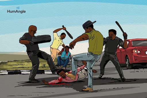 A group of people are attacking a person on the ground with sticks near a red car, while two others watch nearby.