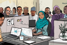 Illustrated office scene with diverse individuals at desks, some smiling and one working on a laptop, with the HumAngle logo visible.