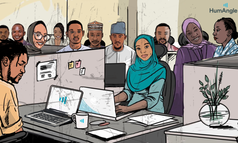 Illustrated office scene with diverse individuals at desks, some smiling and one working on a laptop, with the HumAngle logo visible.