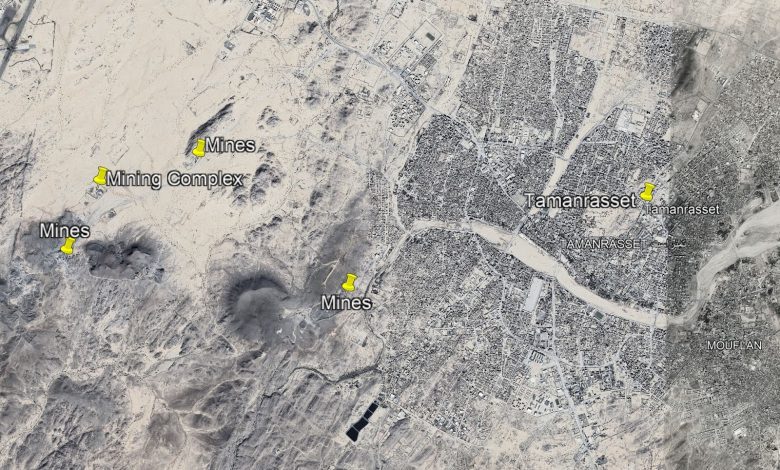 Satellite view of Tamanrasset, Algeria, showing labeled mines and a mining complex in the surrounding desert area.