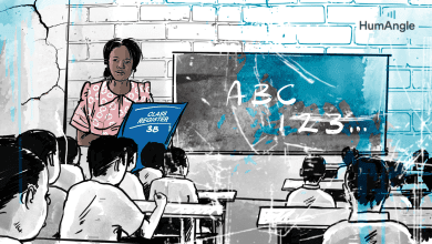 Teacher holds a class register in front of students in a classroom, with ABC and 123 written on the board. Cracked wall background.