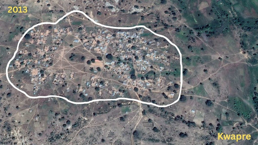 Aerial view of Kwapre village in 2013, with a white outline showing the settlement area.