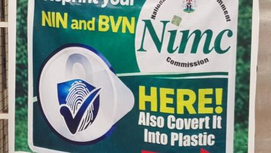 Sign for reprinting and plastic conversion of NIN and BVN at NIMC Commission with an arrow pointing right.